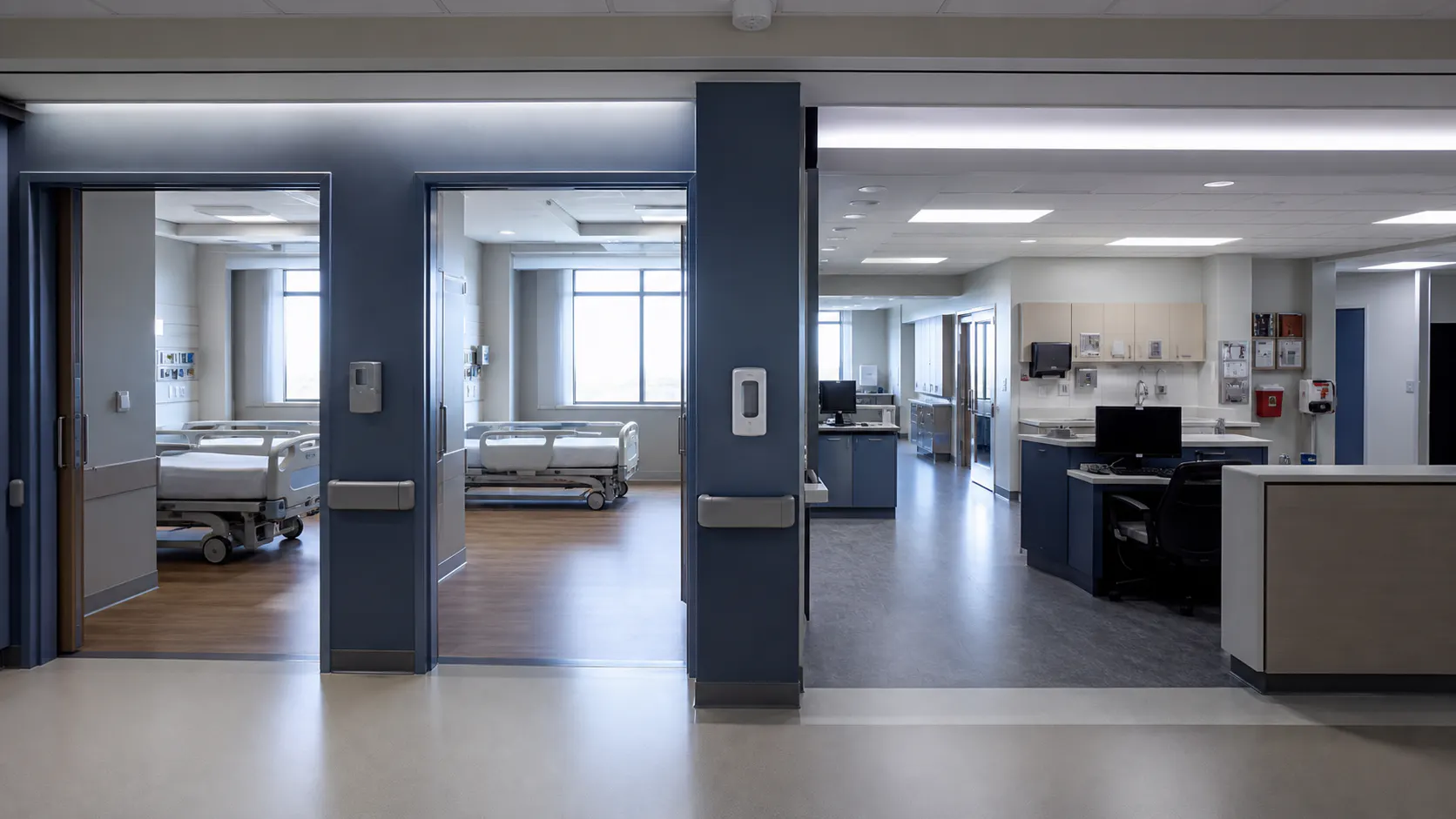 Healthcare suite threshold between empty sleeping rooms and a supervised clinical work area